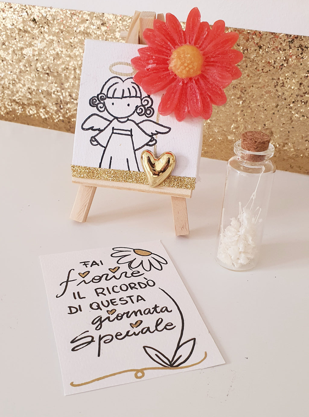 TELA CON FIORE IN CERA E DISEGNO E AMPOLLA CON SEMI DI FIORI